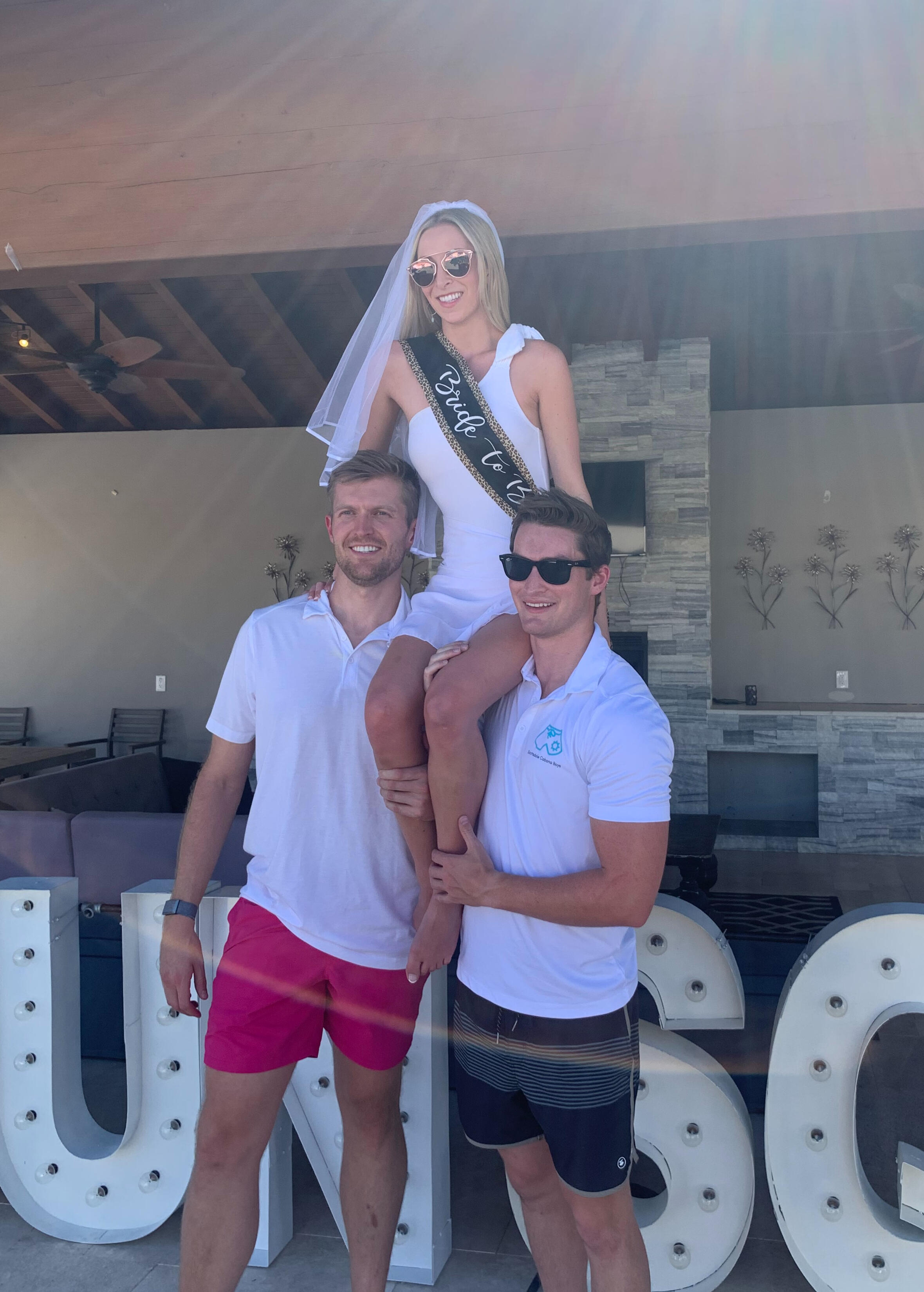 Cabana Boys staff with a bride-to-be at a bachelorette event